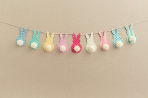 Easter Bunny Banner. Cute bunny shapes with yarn pom pom tails.